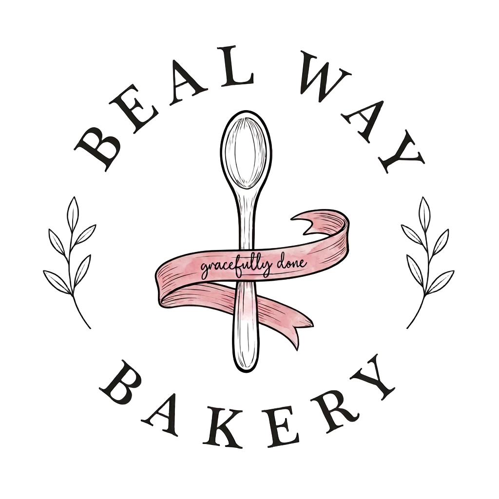 The Beal Way Bakery logo: a wooden spoon wrapped in a ribbon reading Gracefully Done, framed by leaf sprigs